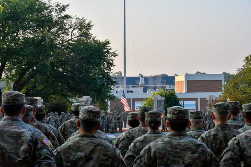 Cadets are seen from behind as they gather for morning formation on Upper Quad.