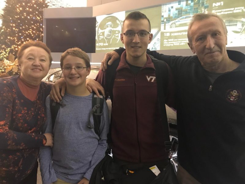 Tim Covert, a Virginia Tech senior who was born in Ukraine, with his grandparents and his brother. His grandparents and other family in Ukraine fled their home in Kyiv, the capital city. Photo courtesy of Covert.
