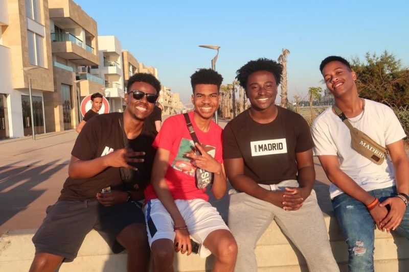 KD Kwarteng sits with friends he met through the Rising Sophomore Abroad Program in Spain.