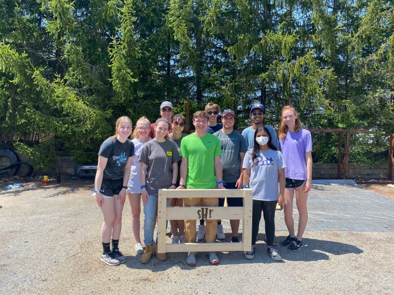 Stamps Scholars from the Virginia Tech Honors College pose with a Sleep in Heavenly Peace headboard