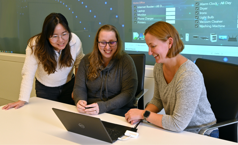 Right to left: National Security Institute Deputy Director Laura Freeman works with Intelligent Systems Division Project Coordinator Danielle Kauffman and Commonwealth Cyber Initiative Graduate Research Assistant Wan-Yi Mao. Photo by Hilary Schwab for Virginia Tech. 