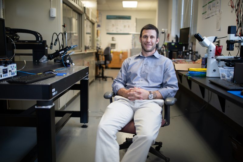 Blake Johnson sits in his lab in Blacksburg. 