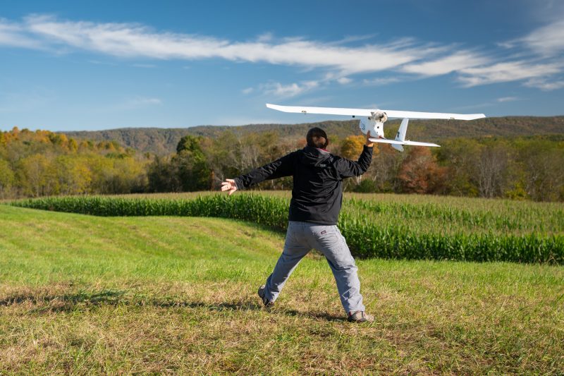 engineer launches a drone 