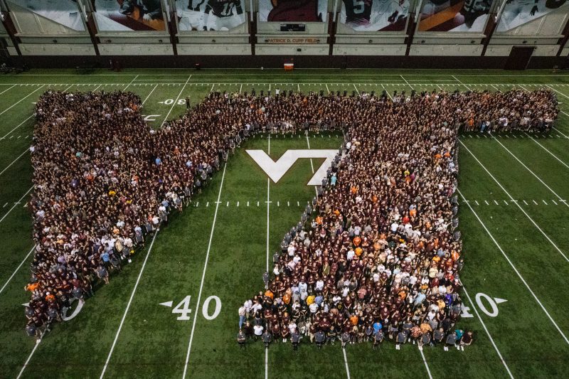 Students from the class of 2026 form a giant human VT logo during the Weeks of Welcome Hokie Spirit Rally. in Lane Stadium.