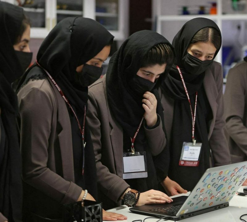 Ayda Haydarpour, center, with her Afghan Girls Robotics Team members.