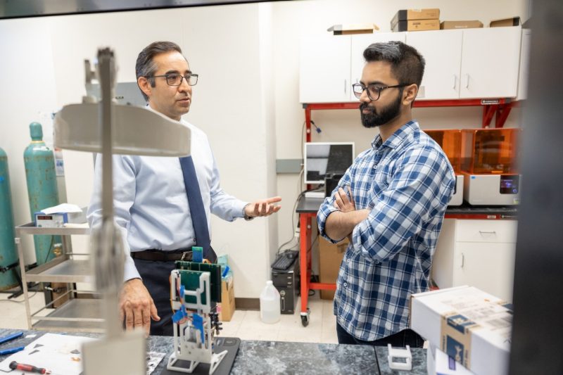 Masoud Agah and Nipun Thamatam in the lab working on the SenSorp device.