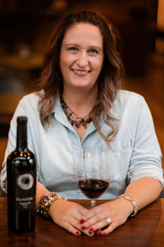 Shawna Miller with bottle of wine