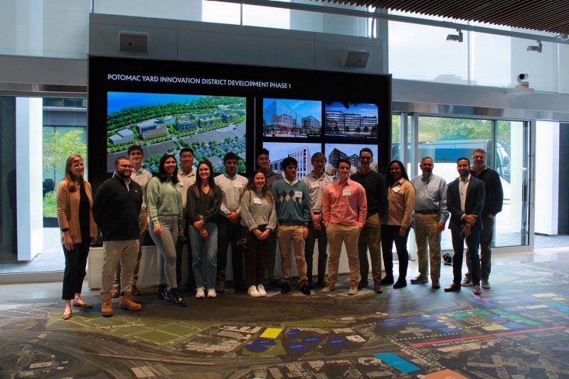 students and faculty pose as a group at the National Landing Bit site in Northern Virginia