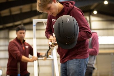 researchers test an equestrian helmet 