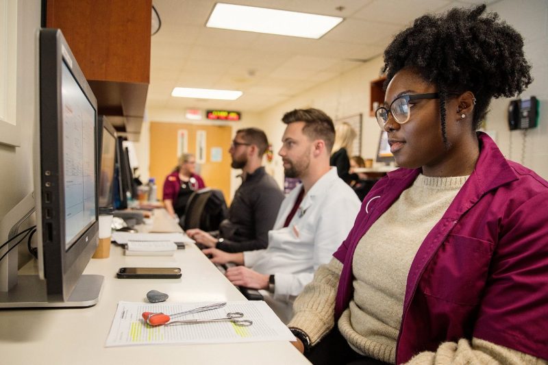 Fourth-year students on clinical rotations at the Veterinary Teaching Hospital update patient records in between consultations and treatments. Fourth-year students on clinical rotations at the Veterinary Teaching Hospital update patient records in between consultations and treatments.