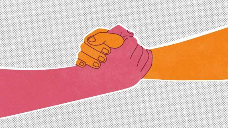 Illustration of two hands clasping, one pink, one orange, in front of a dot grid background.