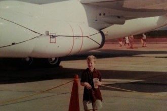 Stewart, age six, at the Langley airshow in front of an E-3 Sentry