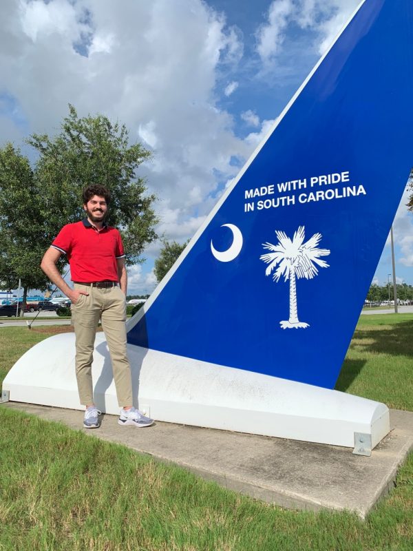 Mody stands in front of Boeing South Carolina Sign