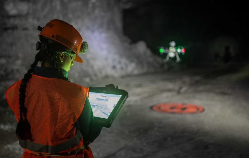 Student running a drone in an underground mine