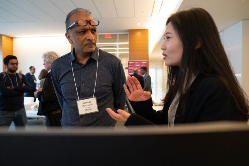 Shehzad Mevawalla, vice president of Alexa Speech Recognition, engages with Virginia Tech Ph.D student.