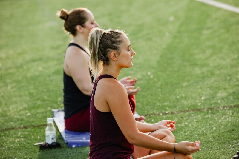 Students meditate in a Recreational Sports program.