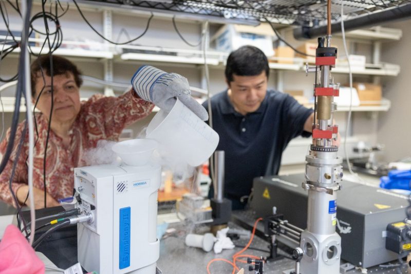 Two researchers work alongside each other in a Virginia Tech lab