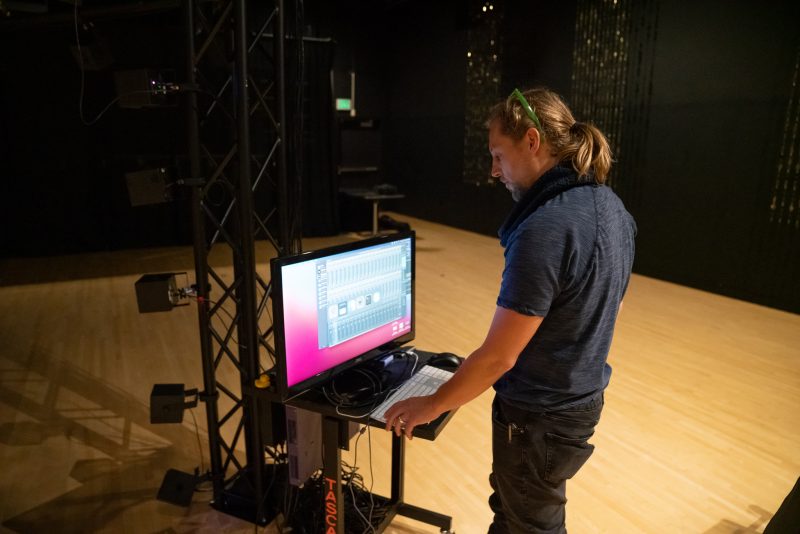 Tanner Upthegrove, a media engineer at Virginia Tech’s Institute for Creativity, Arts, and Technology, works on his high-density loudspeaker array, or tesseract. This display, which simulates the sounds of a cyberattack, was part of a display of the Art of Cybersecurity at the Taubman Museum of Art in Roanoke in 2022.
