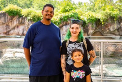 An employee and their family pose for a picture at the North Carolina Zoo. Photo by Darren Van Dyke for Virginia Tech Dining Services.