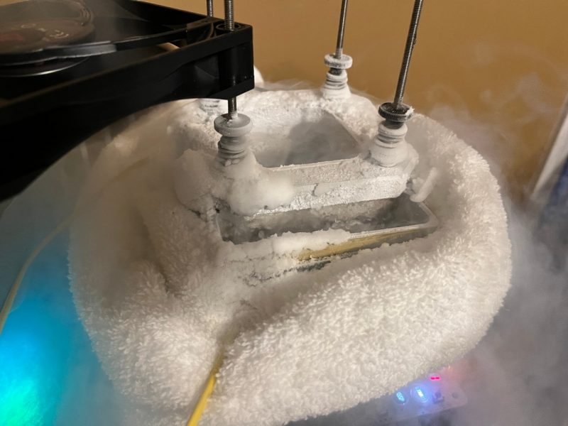 Thick towels are wrapped around computer components with liquid nitrogen to cool down computer components.