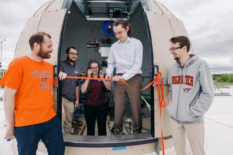 Virginia Tech students Gavin Saul, Nick Angle, Rose Stanphill, Connor Thornhill, and Josh Smoot, performing a "ribbon cutting" after the successful First Light Test of the Virginia Tech National Security Institute's Space Domain Awareness telescope.