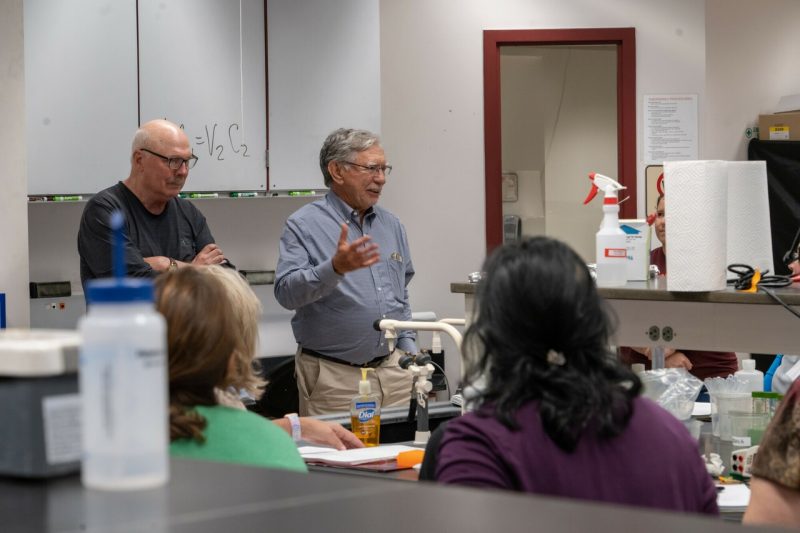 Dennis Dean, left, and Tracy Wilkins talk to high school science teachers at the Biotech in a Box workshops. Photo by Clark DeHart for Virginia Tech.
