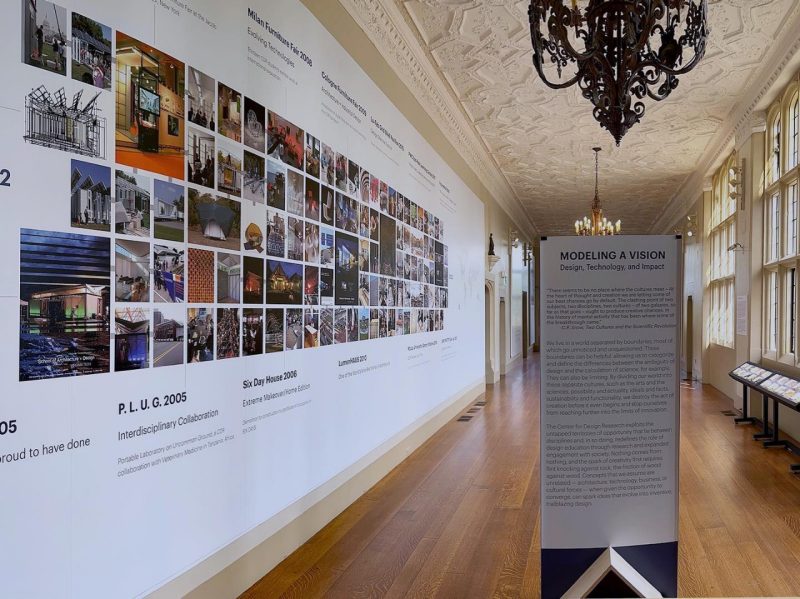 A view of The Branch Museum Hall features a 13-by-40-foot wall displaying 150 images of work created between 2002 and 2022.