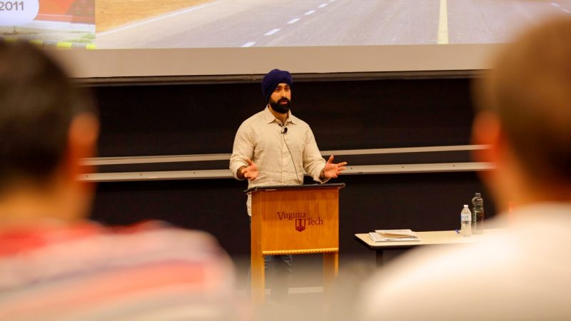 Harjas Singh ‘15 speaks to a classroom full of computer science students.