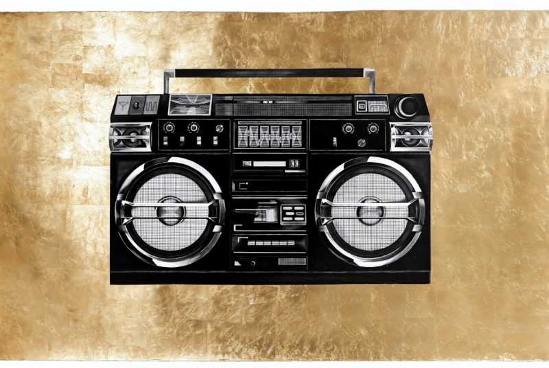 william cordova's  "lasonic trc 931 (baron samedi)," 2022, features an image of an boombox - a large radio with speakers used in the 1980s - floating in the center of a gold leaf background.
