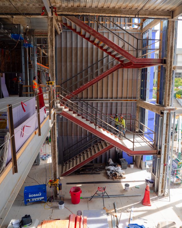 A photo showcasing stairs in the new Hitt Hall - this shows how many floors and how big the building will be.
