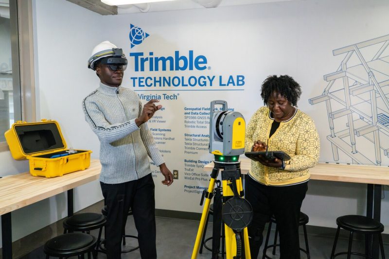 Ph.D. Student Anthony Yusuf and Associate Professor Abiola Akanmu, both of the Myers-Lawson School of Construction, in the Trimble Technology Lab.