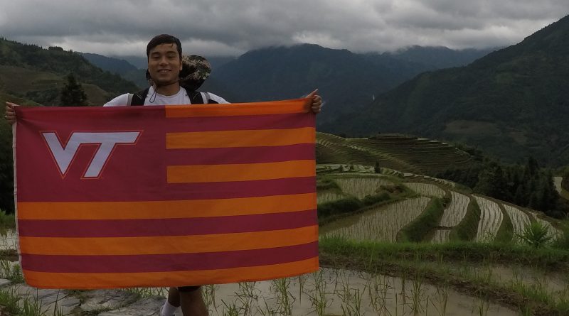 Matt Krusiec with a VT flag while in China