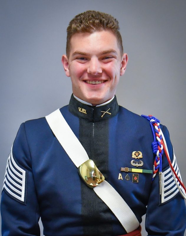Portrait of Cadet Lerner. His uniform blouse is blue and he is wearing a white crossbelt with a brass breastplate.