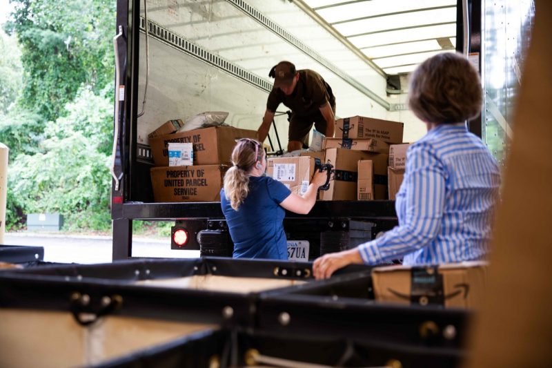 Mail Services unloading packages from UPS truck
