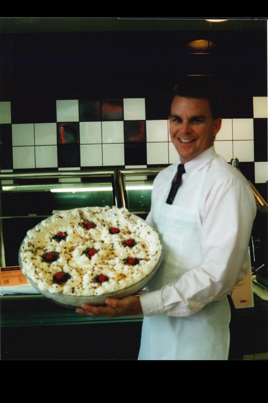 Ted Faulkner showcases a dish at a special event.
