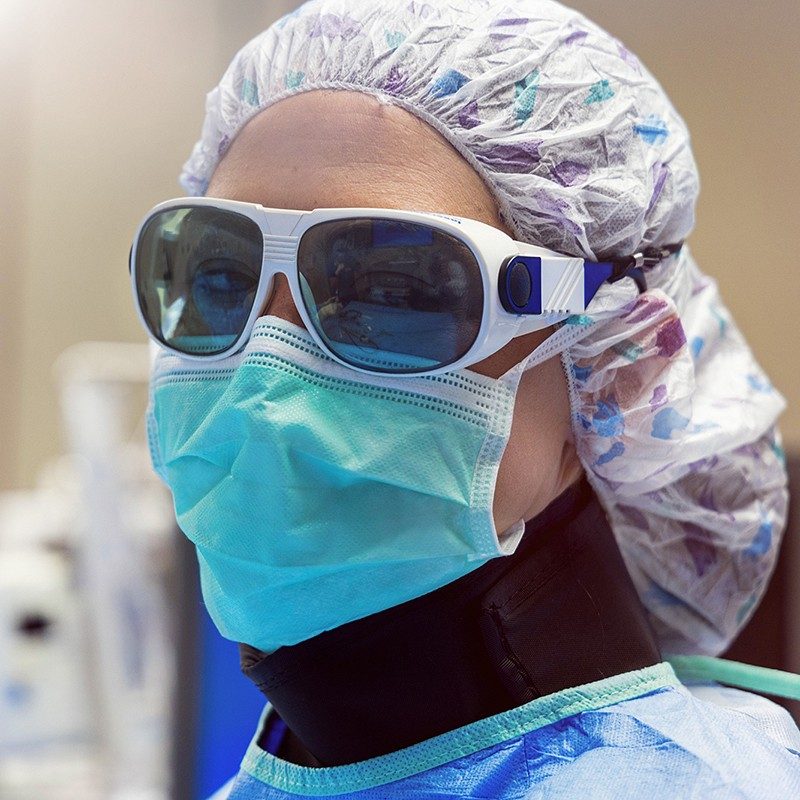 Surgeon in full PPE.