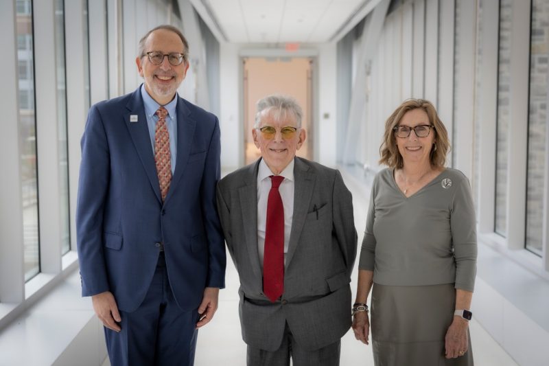 Dean Lee Learman, Ronald Hardin and Patty Vari stand in the bridge that connects buildings in Roanoke.
