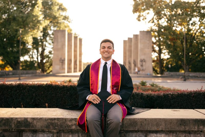 Jackson Sirbaugh sits in front of the pylons at Virginia Tech.