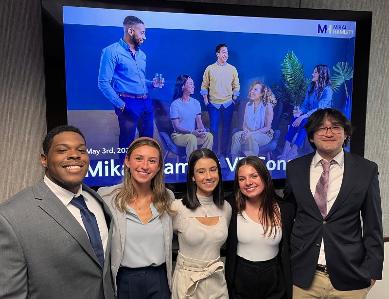 (From left) Daunte Harris, Lindsay Semmes, Cristina Nedelcu, Elizabeth Phillips, and Glen Terwilliger served as pro bono consultants for Mikal-Hamlett in the Management Consulting capstone course. Photo courtesy of Dirk Buengel.