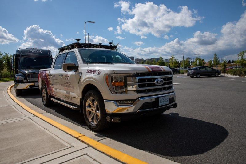 A 2022 Ford F-150 converted to a level 4 autonomous car that is wrapped in logos for a demonstration in Washington D.C.