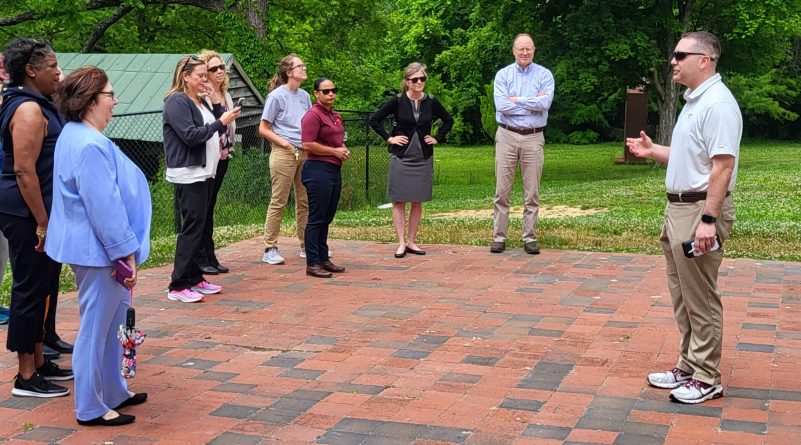 Jon Clark Teglas, chief of staff to the vice president for the Division of Campus Planning, Infrastructure, and Facilities, speaking to a small group of employees about Solitude House at a Walk and Talk .