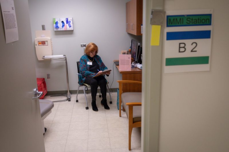 Susan Lucas sits in an exam room waiting to interview a prospective VTCSOM student.