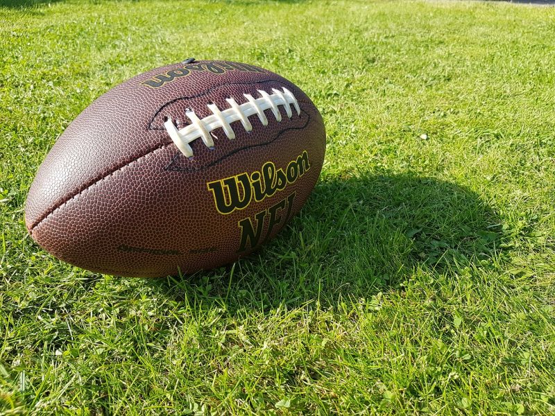 Wilson brand football on grass