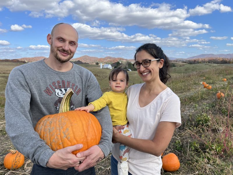 James Weger and Nisha Duggal with their daughter, Leila, at the pumpkin patch.