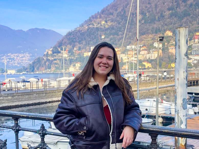 Emily Barcalow standing in front of Lake Como in Italy. 