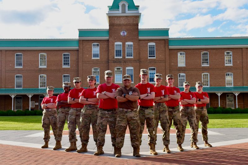 The Corps of Cadets medic staff stands in front of Lane Hall with Andre Asarian at center.