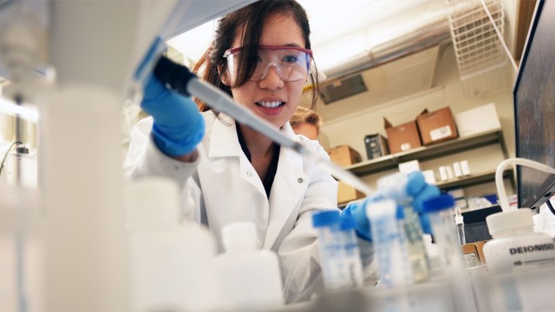 Amanda Leong prepares a sample in the lab of Jinsuo Zhang. Photo by Alex Parrish for Virginia Tech.