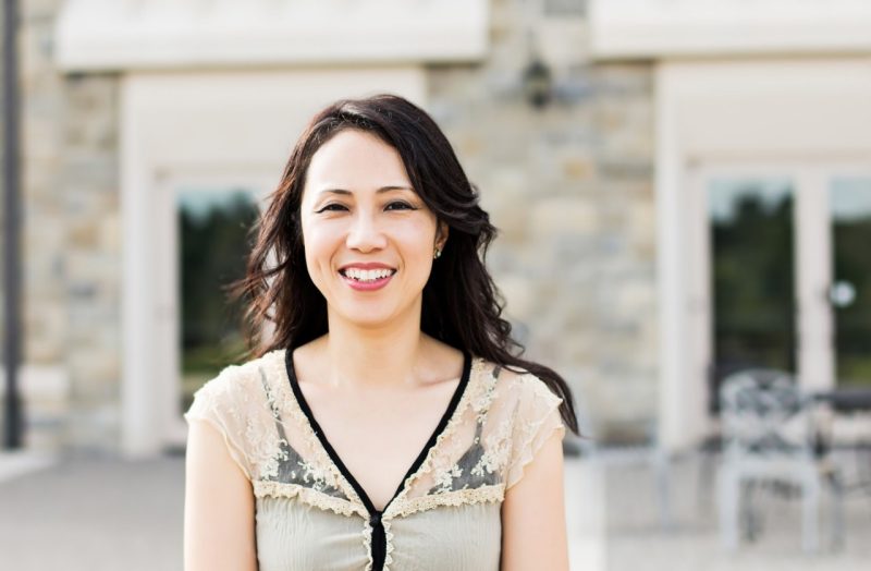 Psychology researcher poses outside