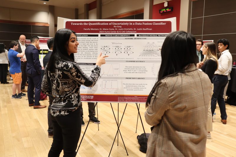 Student presenting research at the 10th Annual Hume Center Colloquium on April 12, 2023.