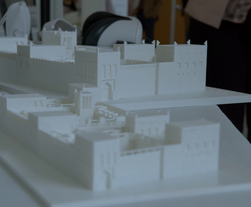A monochromatic model of the house of Sheikh Isa in Bahrain displayed for Bridging Cultures in VR exhibit, on ICAT Day 2023